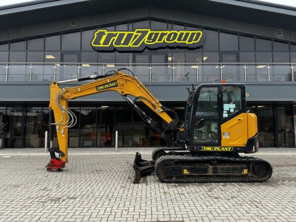 Tru Plant East Anglia digger in front of tru7 group building