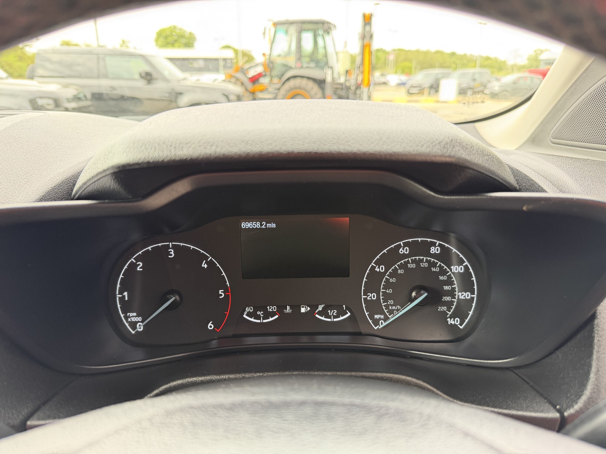 Ford Transit Connect speedometer showing 69,658 miles