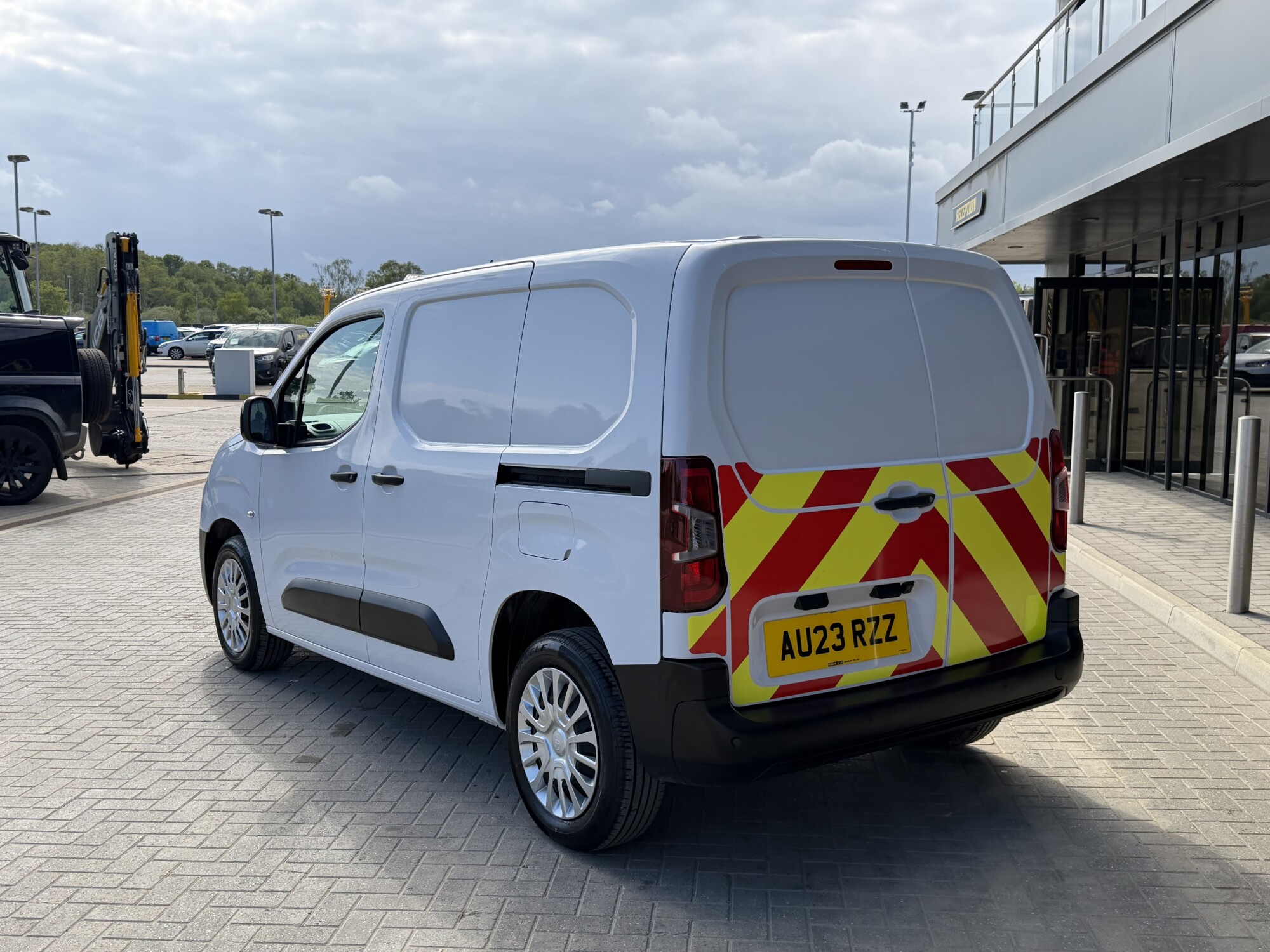Rear three-quarter view of Toyota Proace City van with highway chevrons