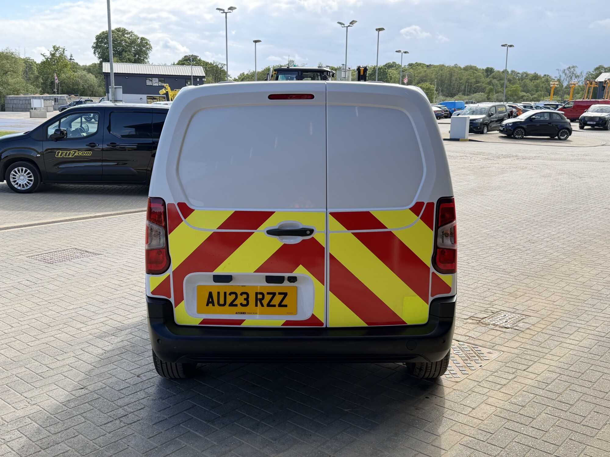 Rear view of Toyota Proace City van with red and yellow highway chevrons