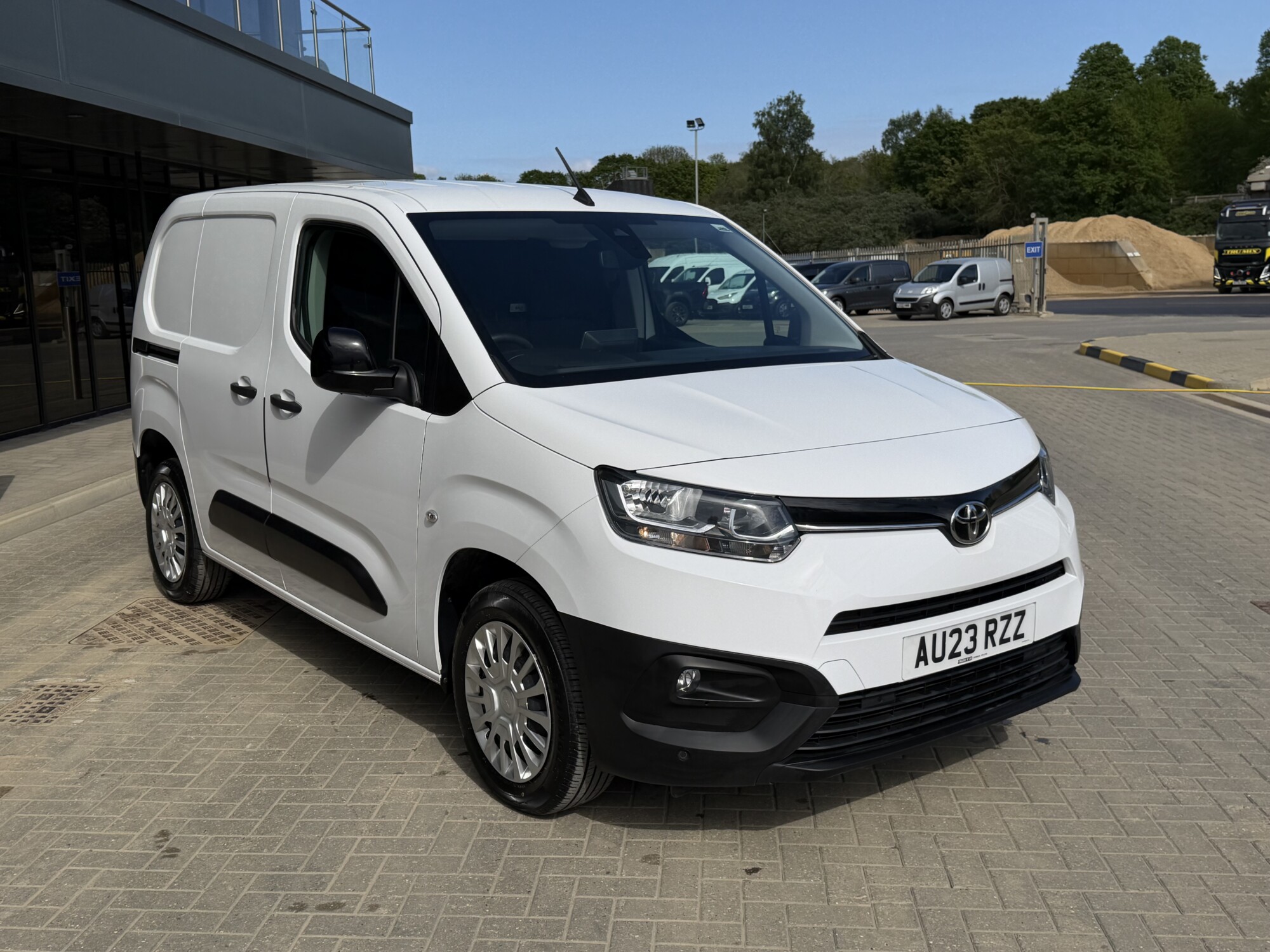 Front three-quarter view of white Toyota Proace City van outside Tru7 Group headquarters