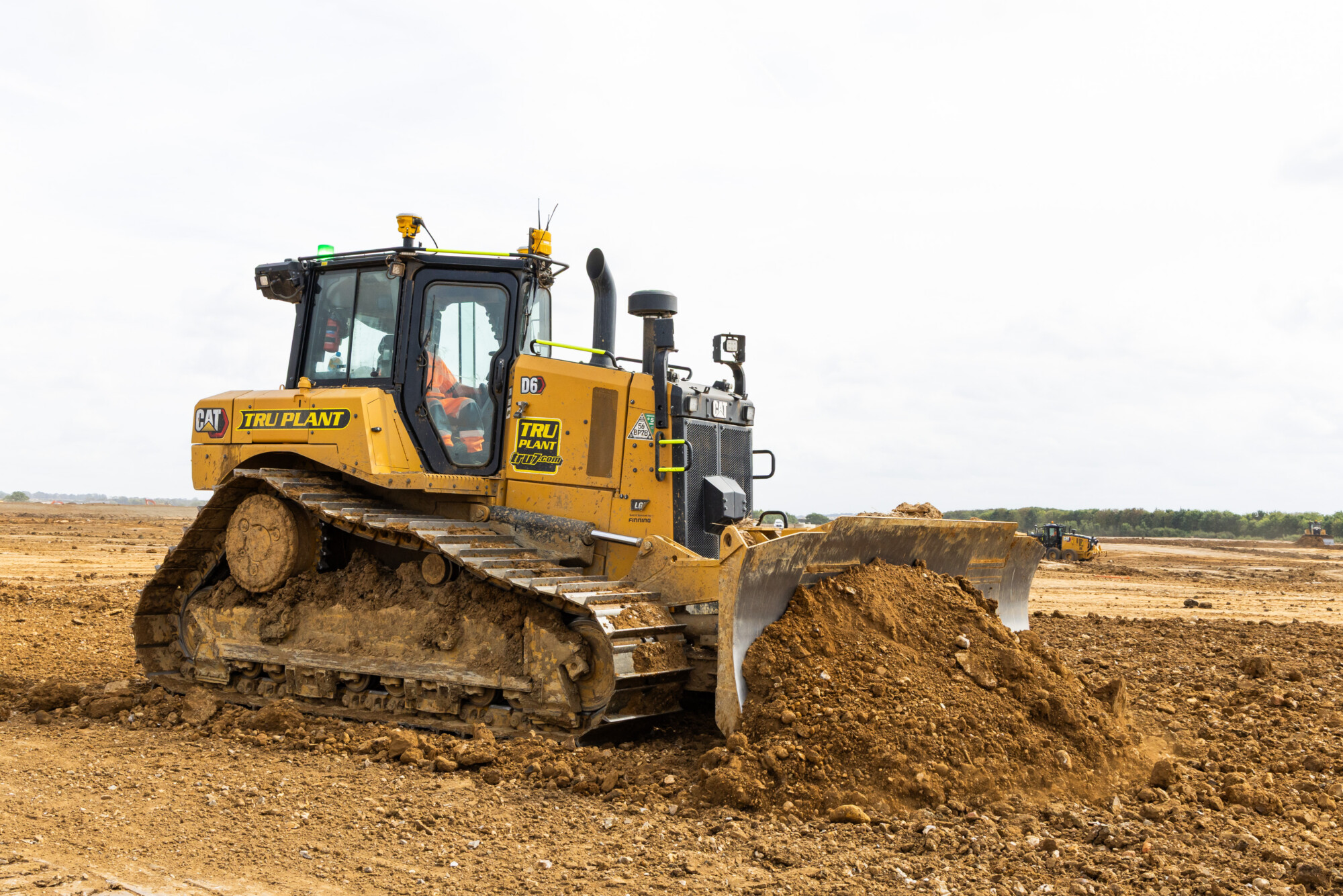 Tru Plant CAT D6 dozer pushing material on an active earthworks site